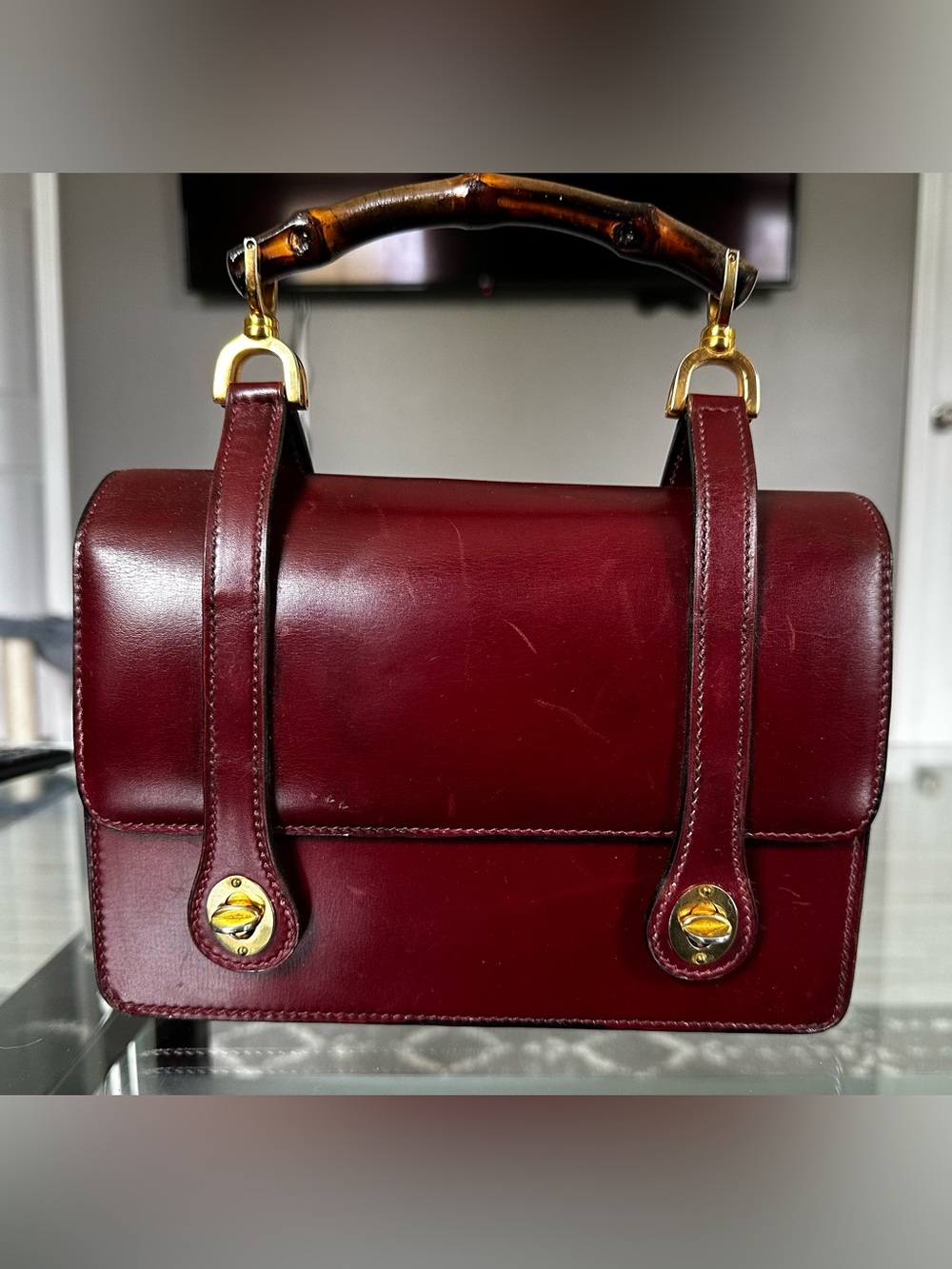 Authentic vintage 1960’s GUCCI lunchbox leather bag in oxblood red.